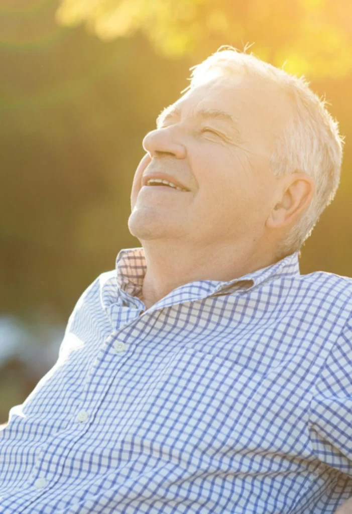 Smiling senior man enjoying the outdoors, representing compassionate senior care for MacDonald Highlands residents