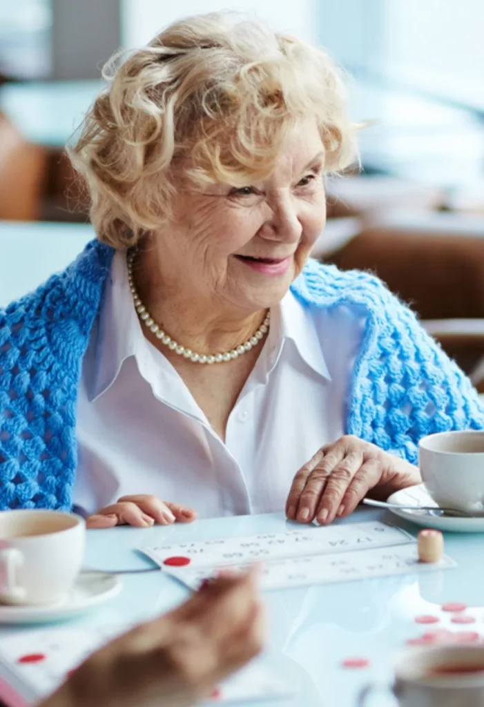 Smiling senior woman enjoying an activity at home, representing compassionate senior care for Sun City Anthem residents