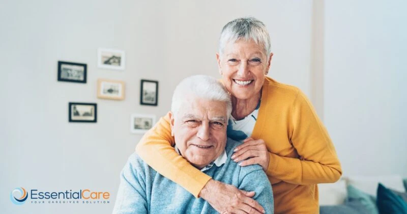 Happy senior couple receiving compassionate in-home care and support from Essential Care