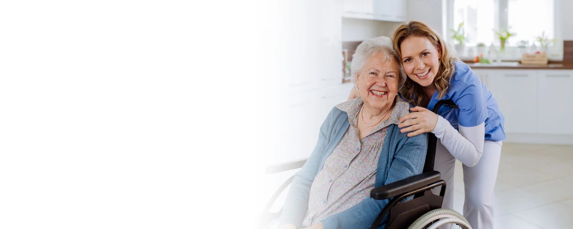 Caregiver supporting a smiling senior woman at home – home care careers