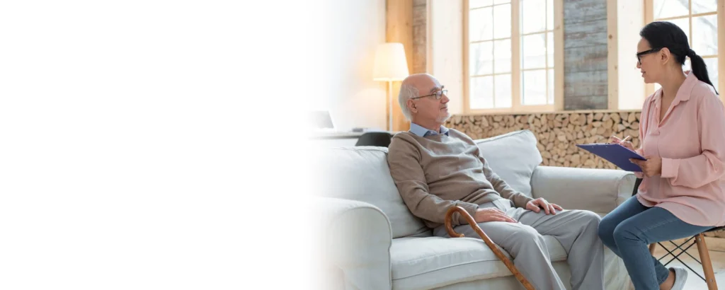 Professional caregiver discussing personalized home care services with a senior at home in Las Vegas, NV