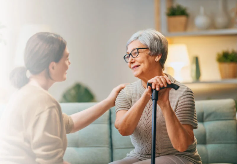 Caregiver comforting an elderly woman at home, representing trusted home care services in Las Vegas and Clark County